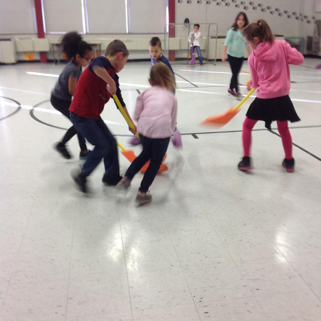 3rd Grade Students Playing Hockey